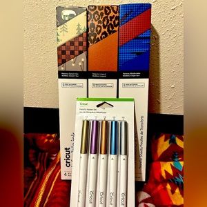 3 unopened Cricut infusible ink htv and an unopened pack of markers